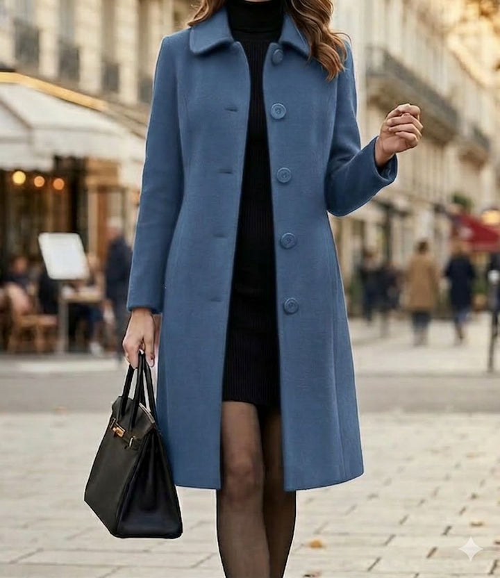 Blue mid-length coat with notched collar and button front, long sleeves.