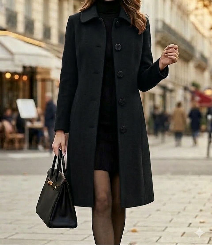 Black mid-length coat with notched collar and button front, long sleeves.