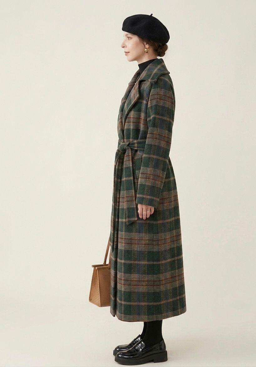 Forest green plaid longline coat side view with belt tie and lapels, long sleeves