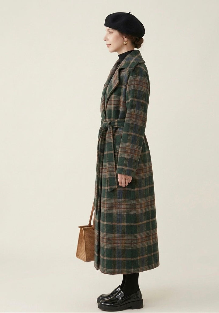 Forest green plaid longline coat side view with belt tie and lapels, long sleeves