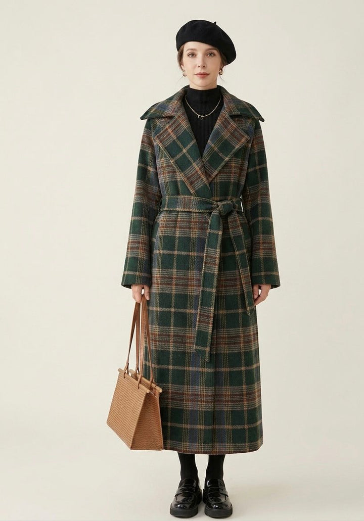 Forest green plaid longline coat with belt, notched lapels and side pockets, worn