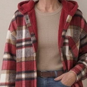 Hooded flannel shacket close-up in red and cream plaid with sherpa hood lining