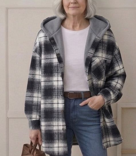 Hooded flannel shacket in black-and-white plaid with sherpa-lined hood, open front