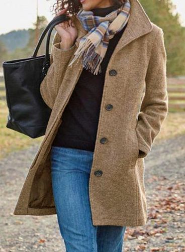 Beige long button-front coat with notched lapels and side pockets worn open