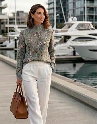 Grey floral knit jumper with multicolor embroidery, ribbed high neck and long sleeves
