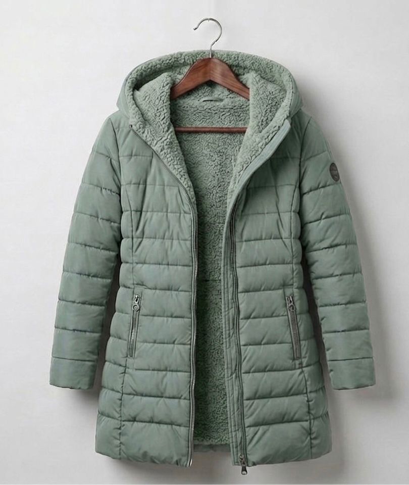 Quilted A-line winter coat in light green, hood with plush lining, full-zip front