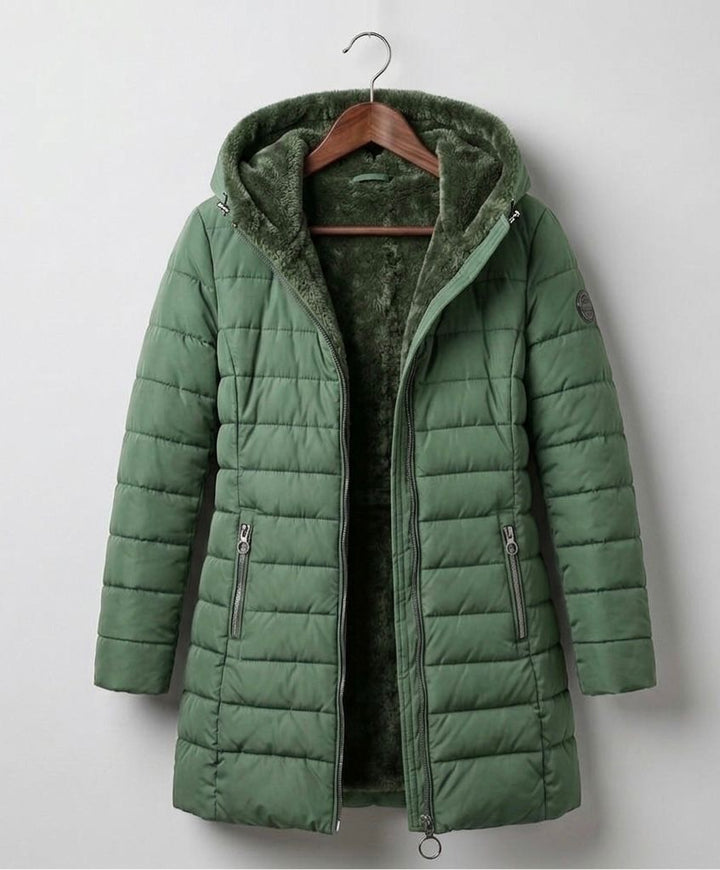 Dark green quilted A-line winter coat with hood, front zipper, and side pockets