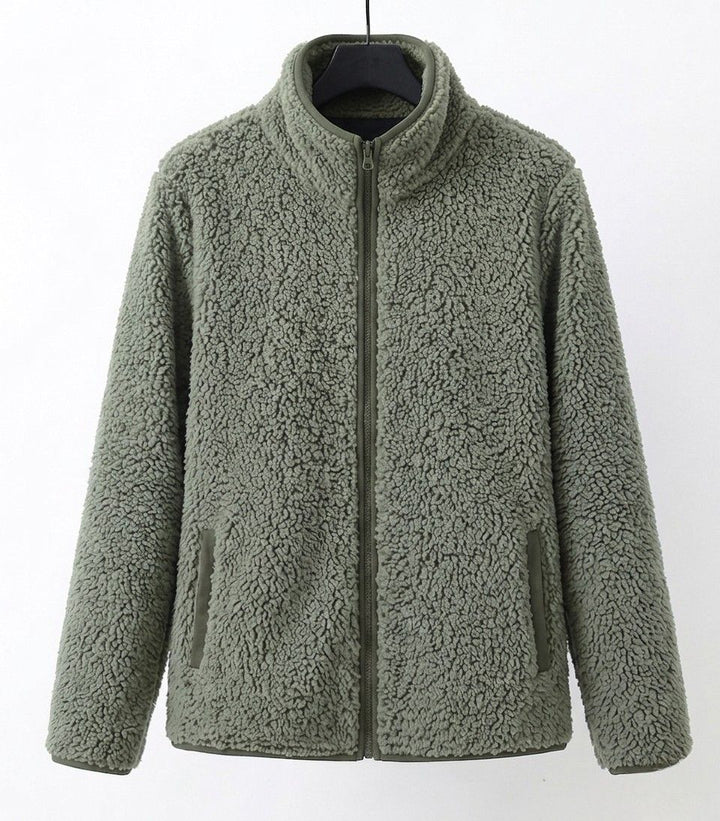 Green teddy jacket with full-zip front and side pockets, stand collar.