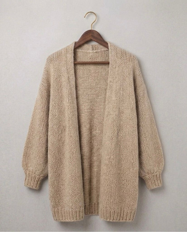 Beige relaxed knit cardigan with open front, chunky sleeves, and ribbed hem cuffs