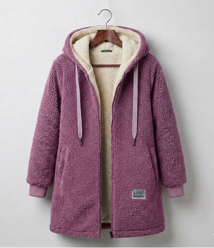 Pink sherpa zip-up hooded coat, cream lining, drawstring ties, front patch pocket.