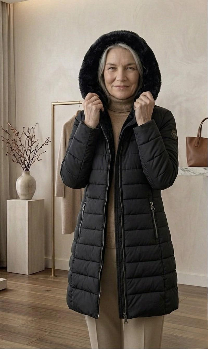 Quilted A-line winter coat in black with plush hood, full zipper, side zip pockets