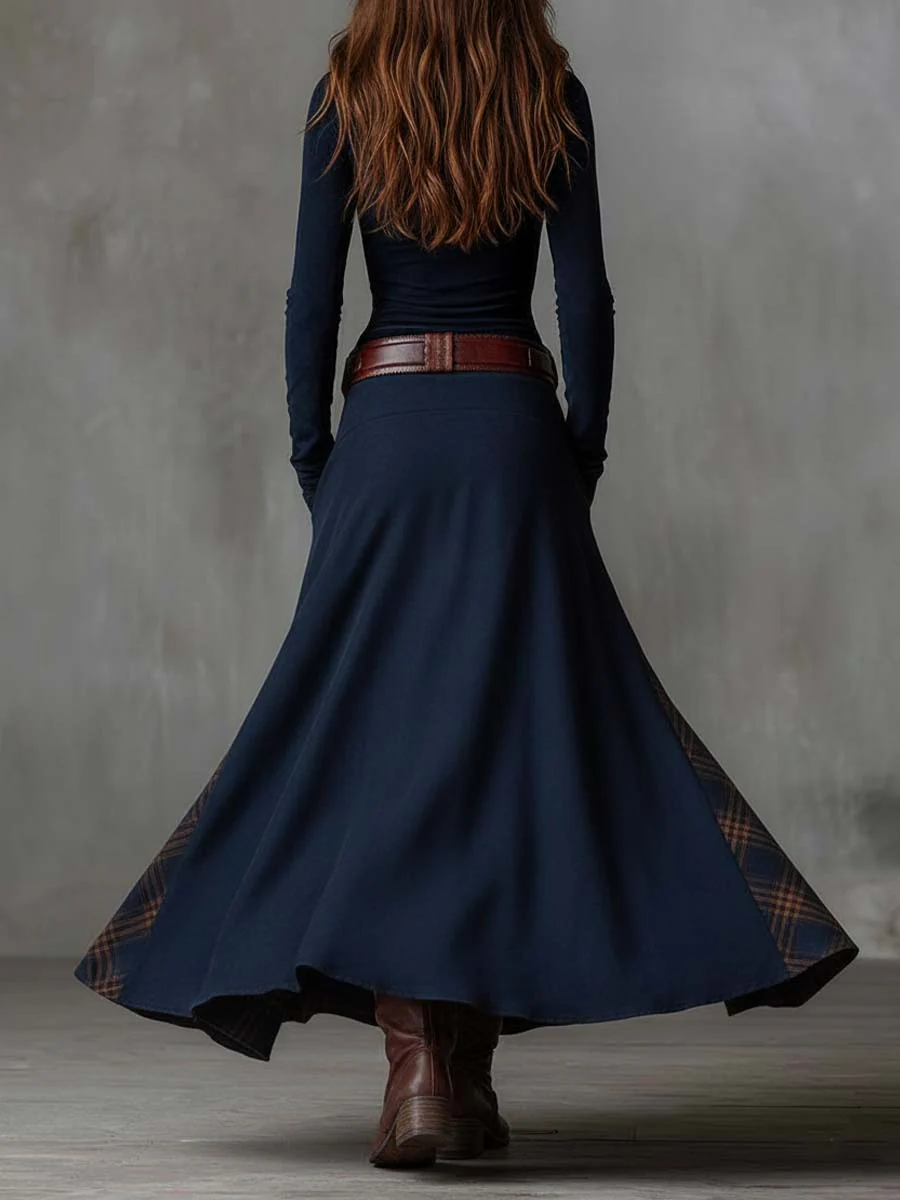 Navy faux suede maxi dress, back view, wide flared skirt and plaid trim panels.
