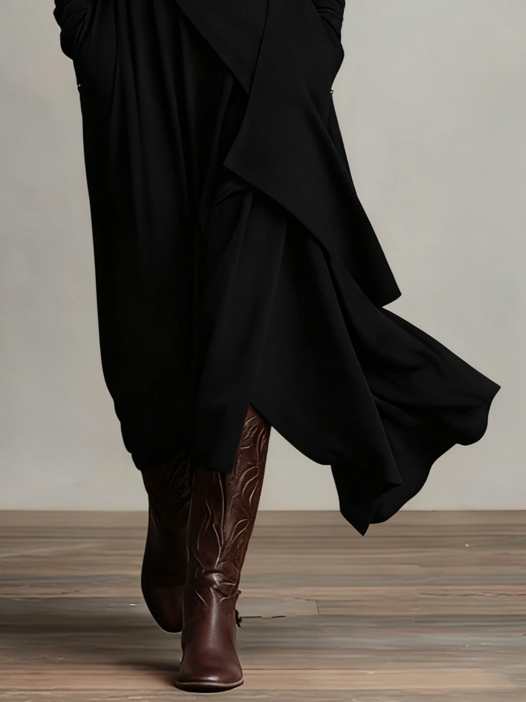 Black high-neck asymmetric maxi dress with draped ruffle hem and long sleeves