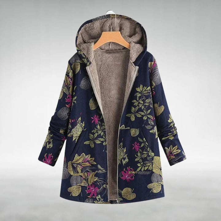 Floral fleece jacket on dark blue with green and pink leaves, gray lining, zip front