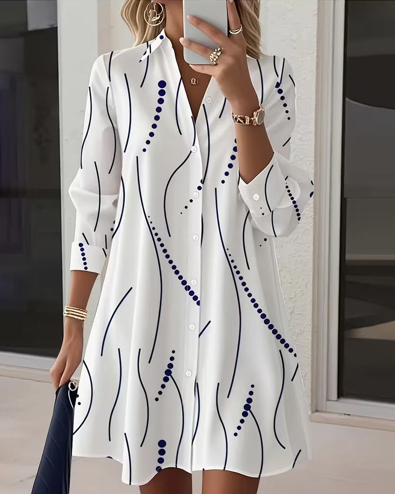 White long-sleeve shirt dress with navy abstract wavy print, button-front and collar