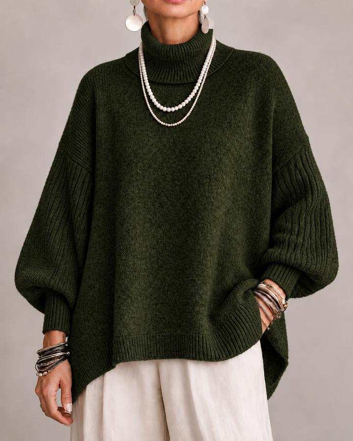 Dark green turtleneck knit sweater with ribbed cuffs and relaxed dolman sleeves.