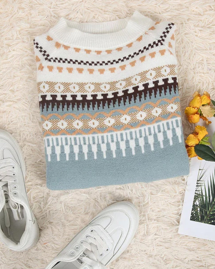 Light blue Fair Isle knit jumper laid flat with crew neck and long sleeves