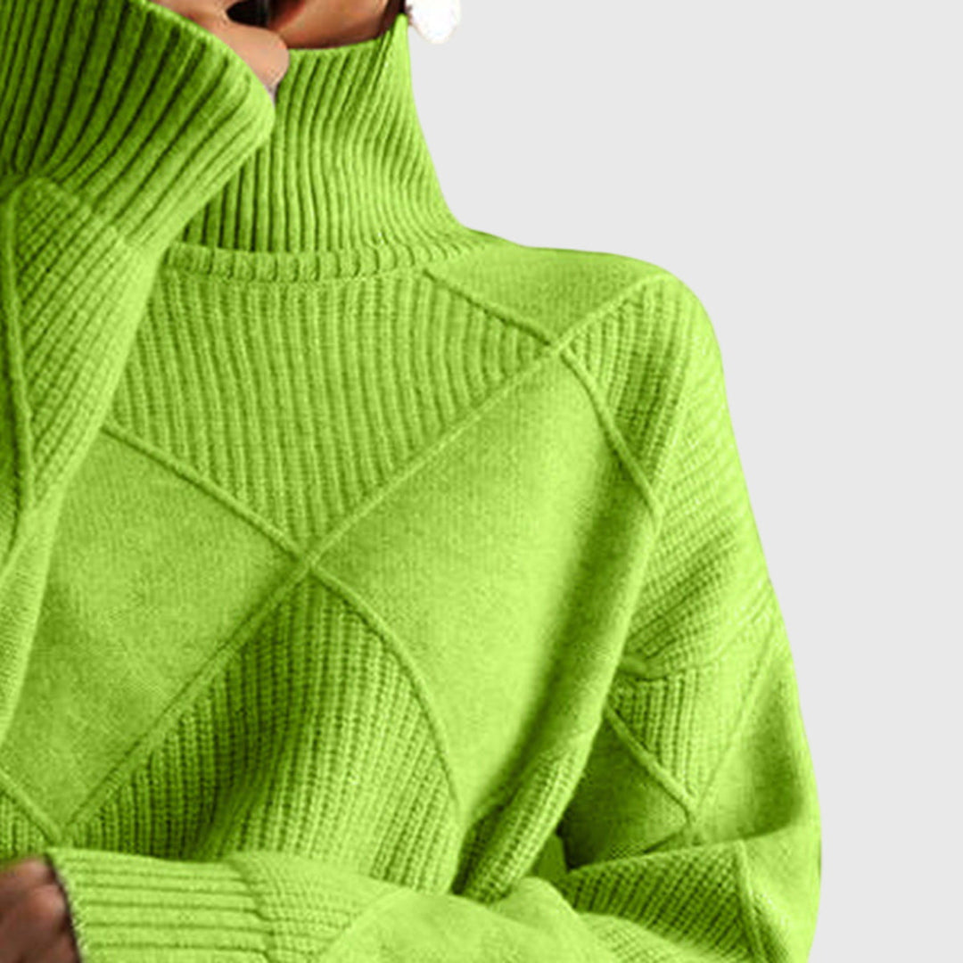 Green turtleneck knit jumper close-up of ribbed collar and diamond panel
