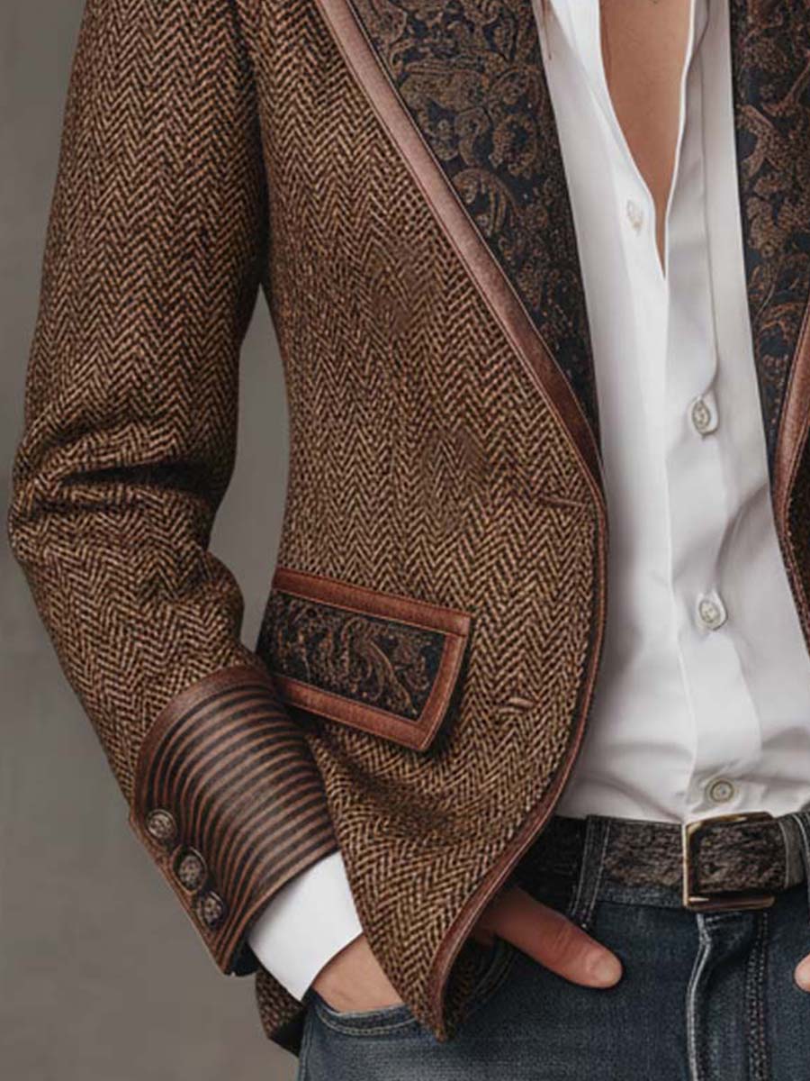 Brown tweed blazer sleeve and pocket detail with dark printed trim at cuff