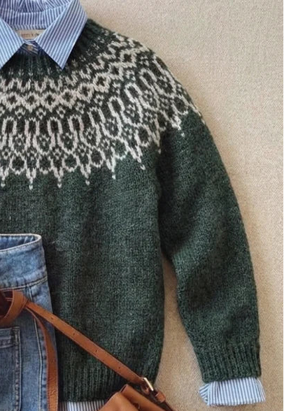 Green knit jumper sleeve with fair isle yoke detail and ribbed cuff