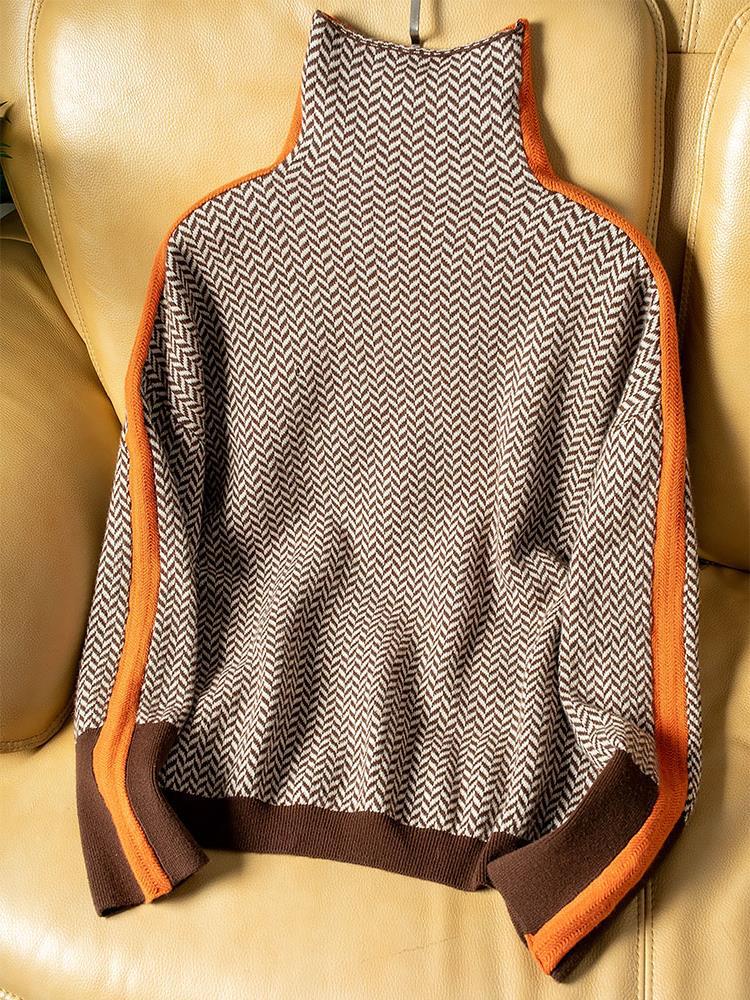 Women’s roll neck sweater with chevron knit and orange contrast trim at cuffs and edges