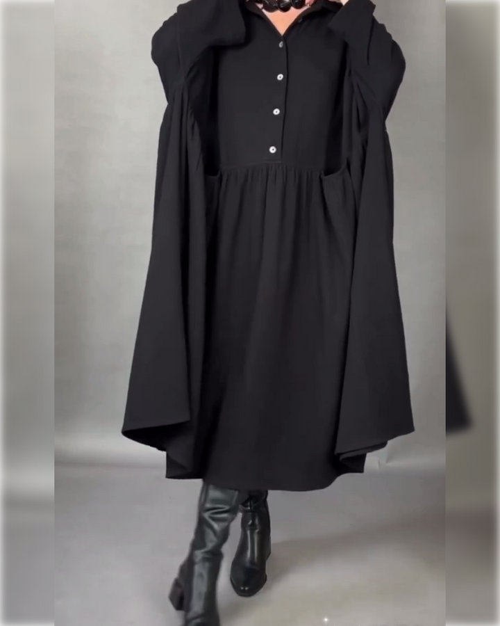 Black long-sleeve A-line button collar dress with gathered waist detail.
