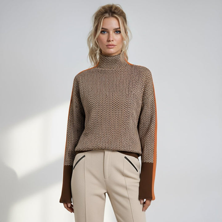 Women’s roll neck chevron jumper with brown base and orange-trimmed sleeve panels