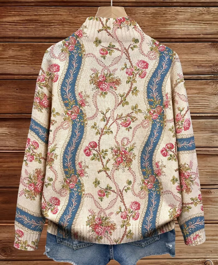 Back view zip cardigan, cream floral paisley with blue vertical trim and ribbed hem