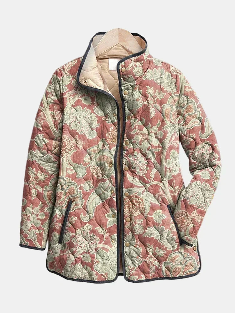 Quilted floral jacket with stand collar, button placket, multicolor pattern and dark trim