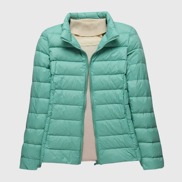 Ultralight jacket in green, stand collar and full-zip with quilted puffer panels