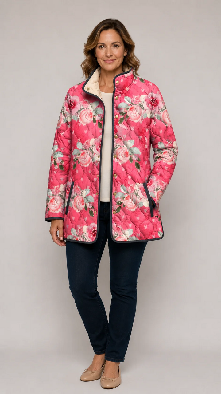 Pink floral quilted jacket with black trim, open front and long sleeves