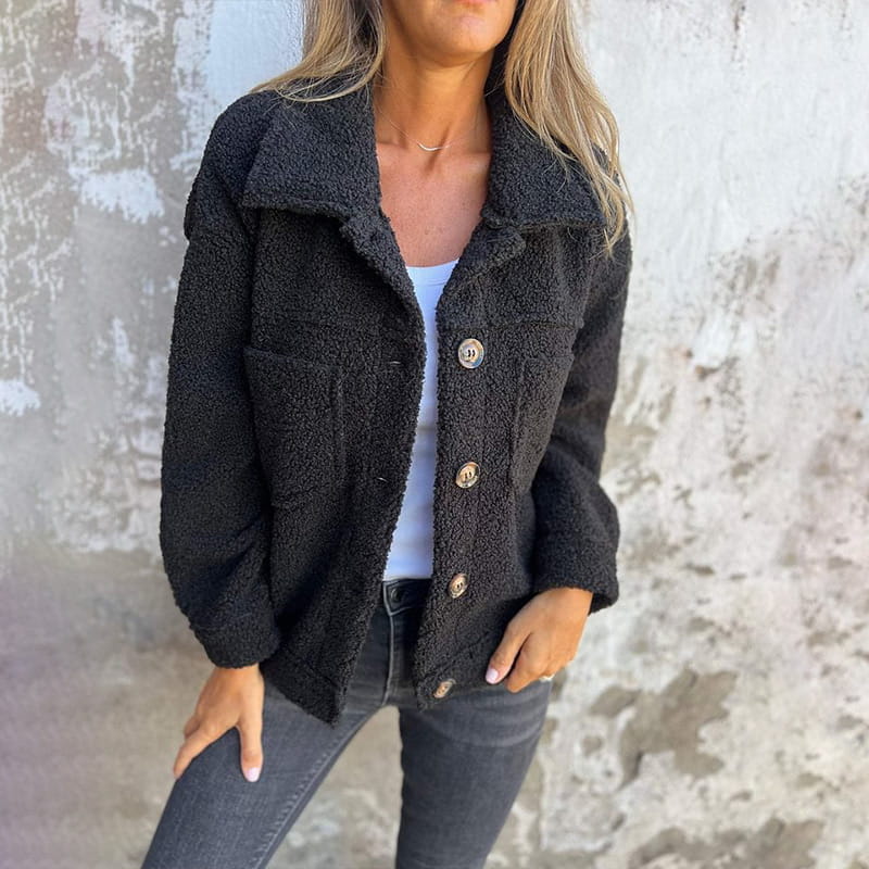 Black teddy jacket with button closure, point collar, and two flap chest pockets