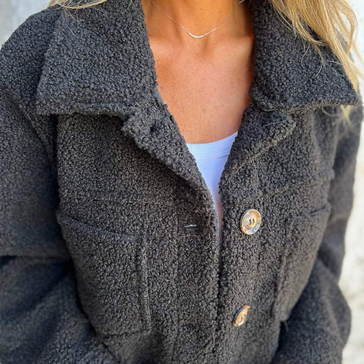 Charcoal teddy jacket close-up with button front and flap chest pockets