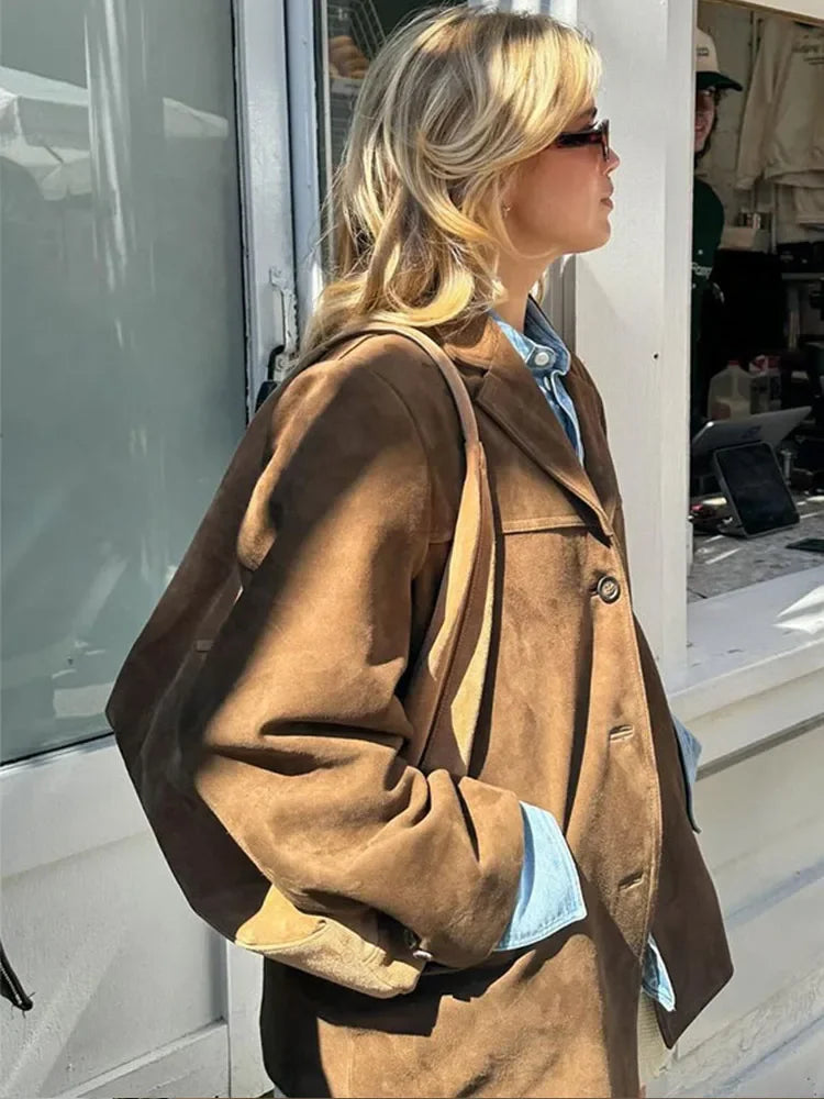 Brown blazer jacket side view with notched lapels and button front