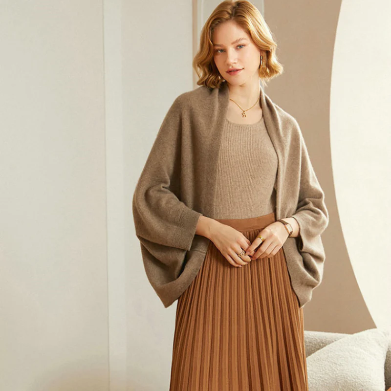 Taupe merino wool shawl worn over a knit top, loose drape sleeves