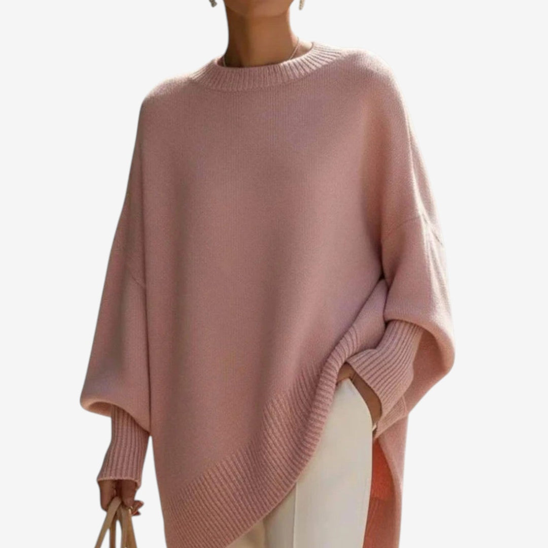Pink asymmetric draped knit poncho with ribbed crew neckline and cuff details
