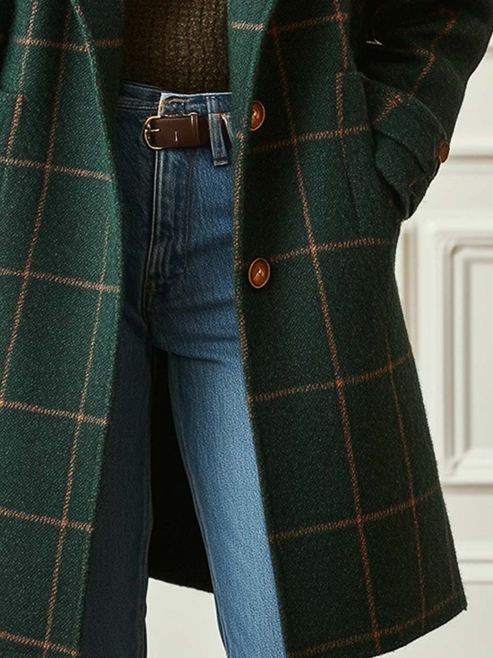 Dark green plaid long coat front view with brown buttons and side seam