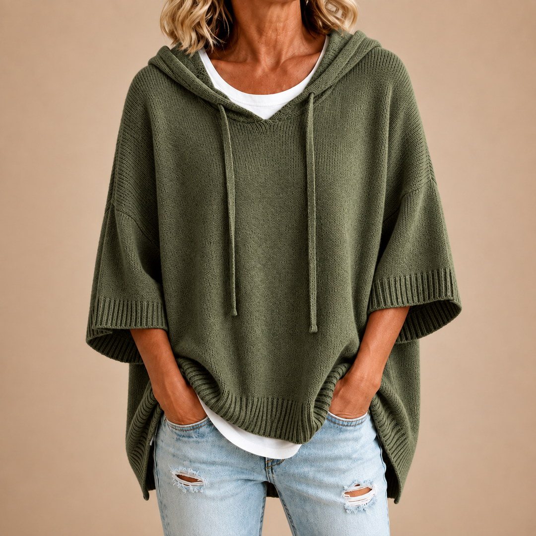 Military green hooded knit poncho sweater with drawstring hood and ribbed cuffs