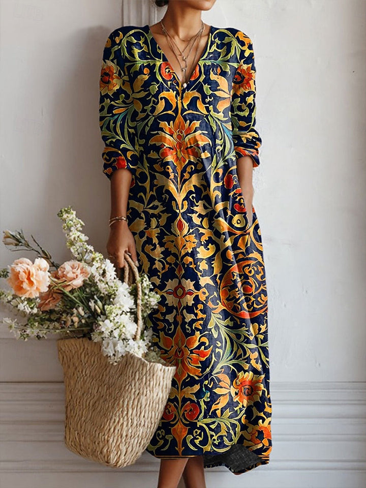 Floral V-neck tunic dress with long sleeves, dark blue, gold, orange-red swirl print