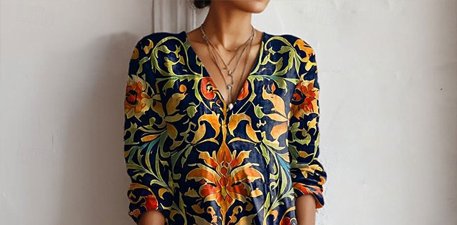 Floral V-neck tunic dress with long sleeves, dark blue with gold and orange-red pattern