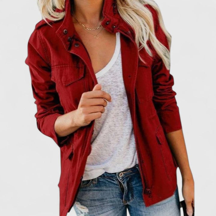 Red utility jacket with snap button front and flap chest pocket, adjustable waist tabs