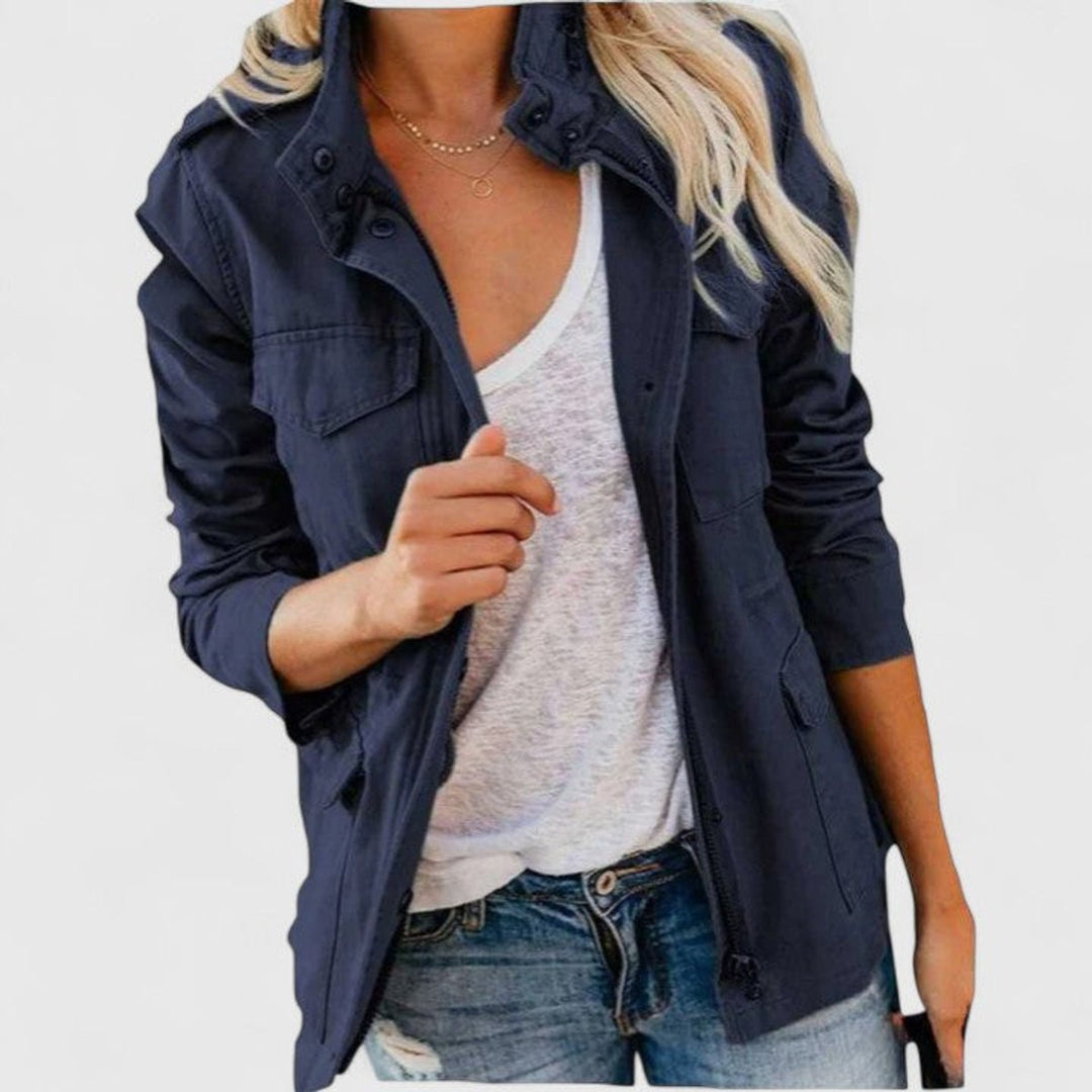 Navy utility jacket with snap button front, flap pockets, adjustable waist tabs