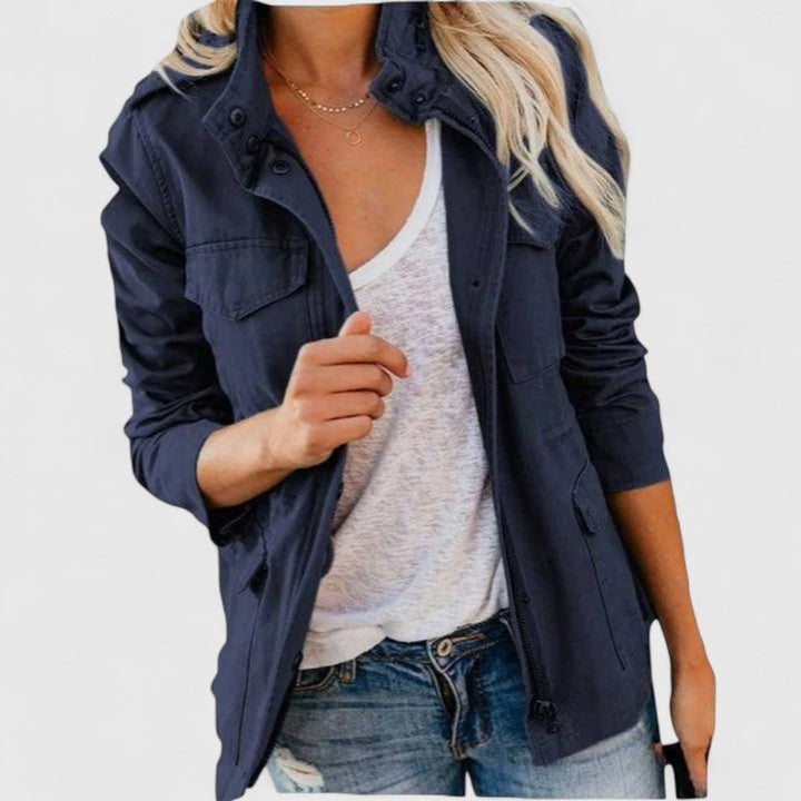 Navy utility jacket with snap button front, flap pockets, adjustable waist tabs