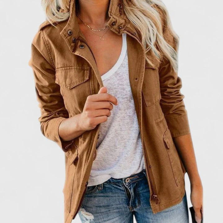 Tan utility jacket with snap button front, chest pocket flaps, adjustable waist tabs