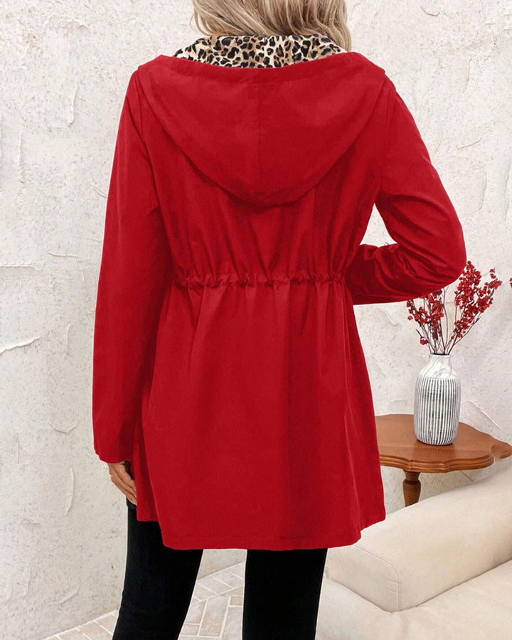 Reversible hooded zip jacket, back view in solid red with gathered waist.