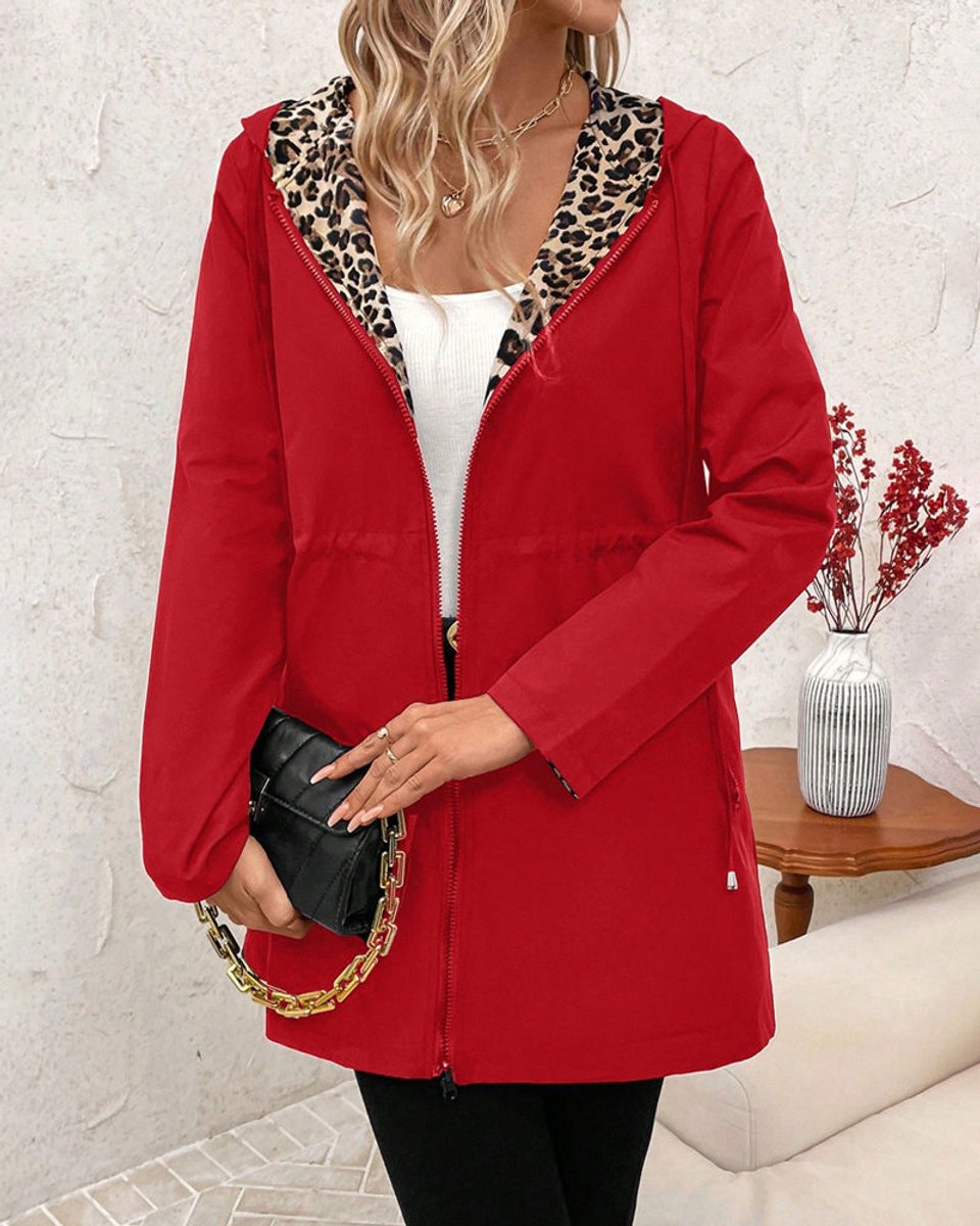 Reversible hooded zip jacket in solid red with leopard-print hood lining.