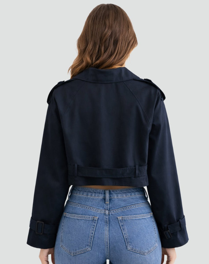 Navy short trench coat with belt, back view with shoulder straps