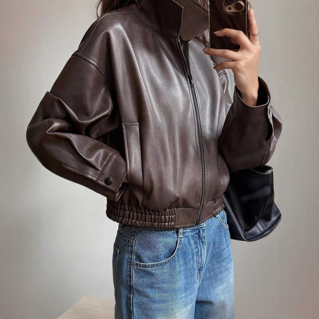 Dark brown bomber jacket angled view with front zipper, ribbed cuffs, and elastic hem