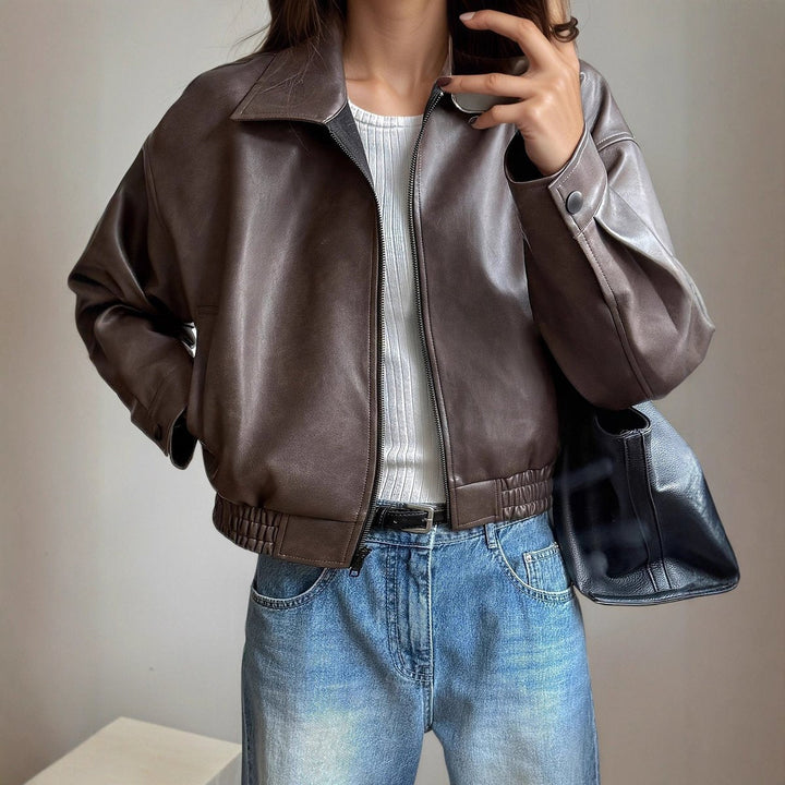 Dark brown bomber jacket with front zipper, ribbed collar, cuffs, and elastic hem