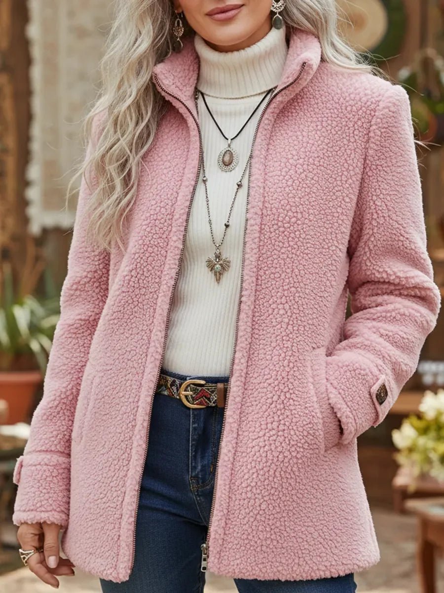 Pink fuzzy fleece jacket with stand collar, long sleeves, and front zip.